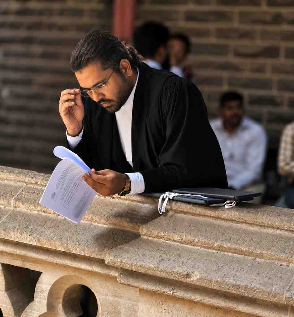 Advocate Ashif Husain — reviewing legal documents